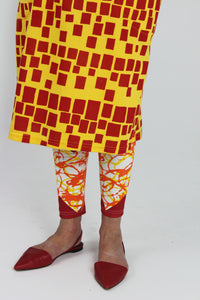 Yellow and red scribble on white cotton lycra leggings