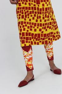 Yellow and red scribble on white cotton lycra leggings