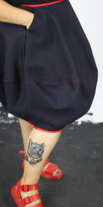 Navy denim bubble skirt with red trim with one pocket and side zip